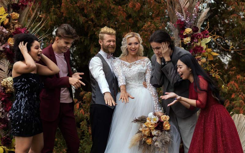 wedding guests celebrating with the couple at a garden reception, affordable wedding coach charter, August 2024, NZ